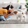 Emotional japanese woman cuddling with her pet at home